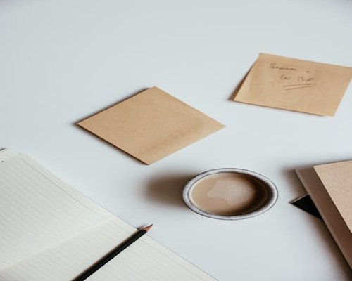 Editorial desk with notes and a cup of coffee